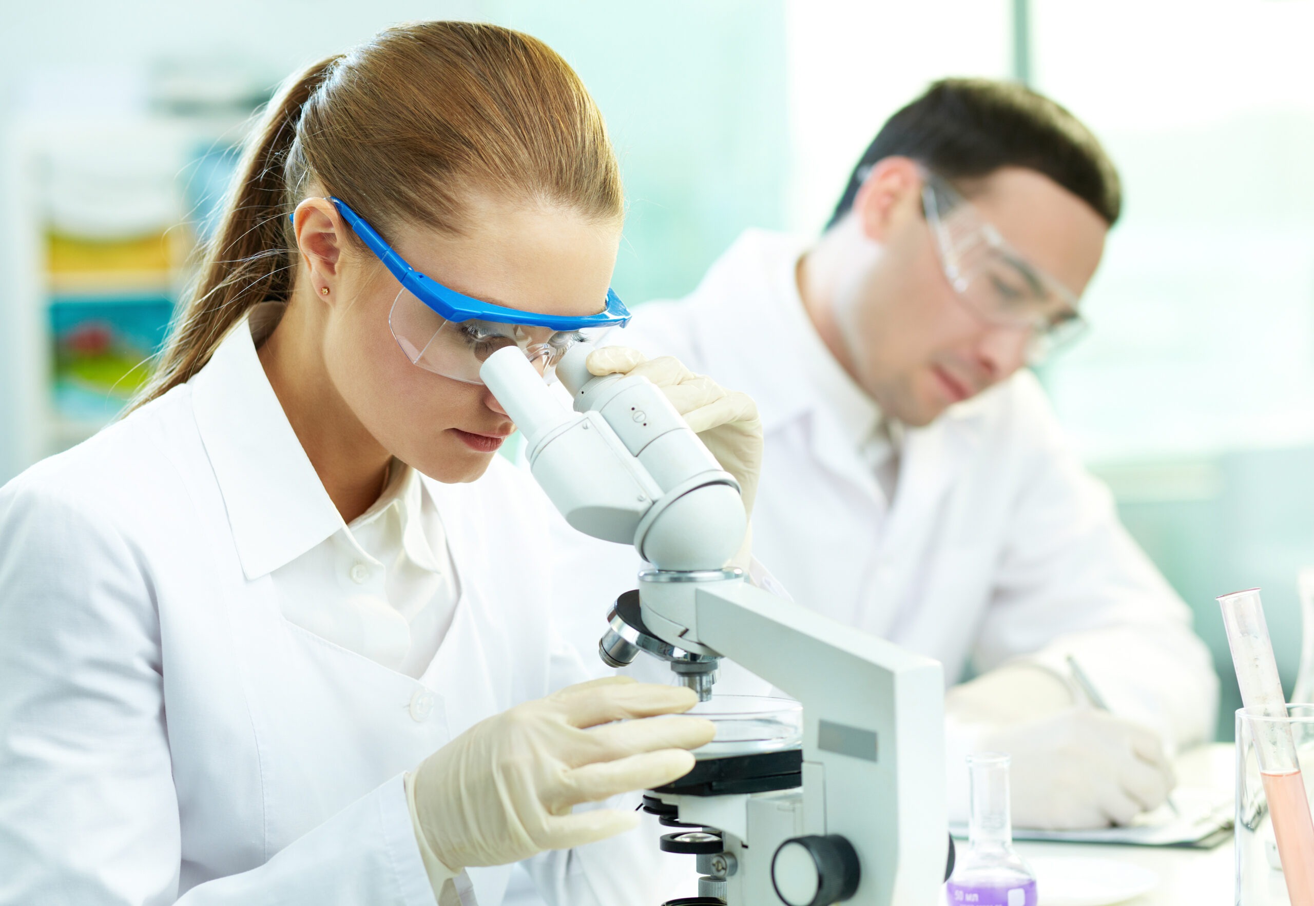Serious clinician studying chemical element in laboratory