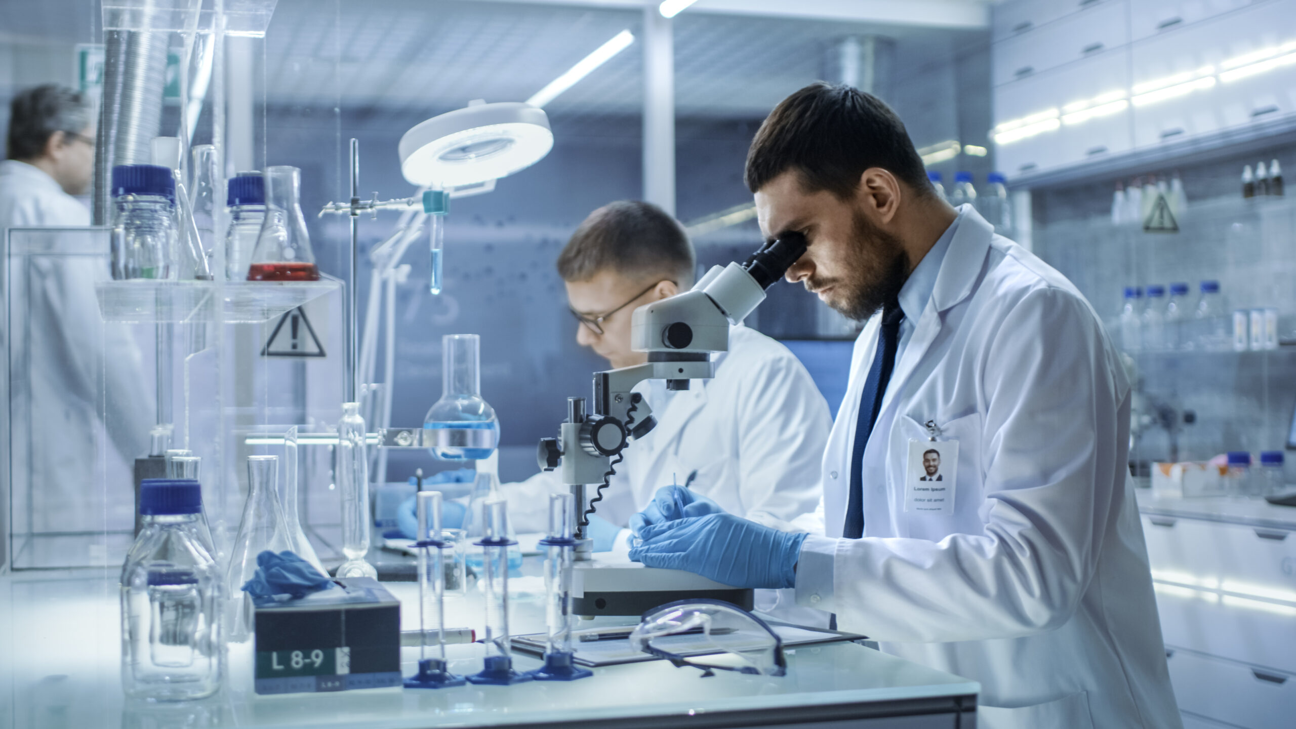 In a Modern Laboratory Two Scientists Conduct